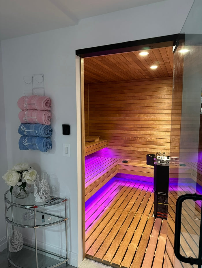 Sauna room looking at thermo aspen with LED lighting under benches